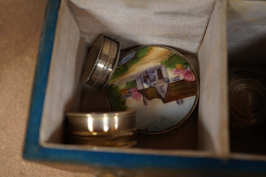 A green leather sectioned box containing a collection of cut glass, silver mounted and silver plated boxes and jars, some with guilloche enamel lids, largest 7cm high